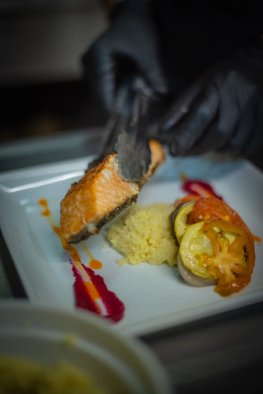 Artfully plated contemporary seafood dish with delicate garnishes